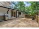 Enjoy outdoor cooking on this deck, featuring a grill and a view of the lush backyard at 2238 Pinecliff Ne Dr, Atlanta, GA 30345
