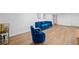 Finished basement area with blue velvet furniture, modern flooring, and stylish decor at 2238 Pinecliff Ne Dr, Atlanta, GA 30345