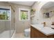 Chic bathroom featuring a walk-in shower, a modern vanity with a vessel sink, and stylish fixtures at 2238 Pinecliff Ne Dr, Atlanta, GA 30345