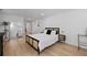 Bright bedroom with contemporary furnishings, including a stylish black bedframe and light wood floors at 2238 Pinecliff Ne Dr, Atlanta, GA 30345