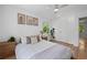 Bright bedroom with neutral decor, hardwood floors, ceiling fan, and a view of the backyard at 2238 Pinecliff Ne Dr, Atlanta, GA 30345