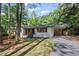 Charming renovated home featuring a light brick facade and convenient carport in a lush, wooded setting at 2238 Pinecliff Ne Dr, Atlanta, GA 30345