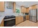Modern kitchen with light wood cabinets, stainless steel appliances, a gas range and quartz countertops at 2238 Pinecliff Ne Dr, Atlanta, GA 30345