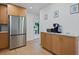 Spacious kitchen with stainless steel refrigerator, wood cabinets, and ample counter space at 2238 Pinecliff Ne Dr, Atlanta, GA 30345