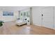 Bright living room with hardwood floors, modern sofa, and large window offering natural light and a peaceful view at 2238 Pinecliff Ne Dr, Atlanta, GA 30345