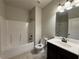 Neutral bathroom features a shower and tub combination, toilet, and vanity at 3488 Woodshade Dr, Loganville, GA 30052