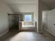 Bathroom featuring a bathtub, glass shower, and window for natural light at 3488 Woodshade Dr, Loganville, GA 30052