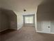Bedroom features carpet flooring, a window, and two storage closets at 3488 Woodshade Dr, Loganville, GA 30052