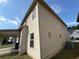 Side exterior showcasing beige siding, a covered area and other nearby homes at 3488 Woodshade Dr, Loganville, GA 30052
