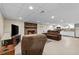 Spacious finished basement with a cozy fireplace and a convenient kitchenette at 4010 Hamilton Mill Rd, Buford, GA 30519