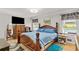 Bedroom with wood furniture, and view to the pool outside at 4010 Hamilton Mill Rd, Buford, GA 30519