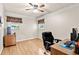 Bright bedroom has hardwood floors, neutral walls, and two windows for natural light at 4010 Hamilton Mill Rd, Buford, GA 30519