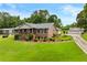 Well-maintained home featuring a lush lawn and a detached multi-car garage at 4010 Hamilton Mill Rd, Buford, GA 30519