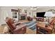 Comfortable living room with a brick fireplace and views into the dining room at 4010 Hamilton Mill Rd, Buford, GA 30519