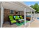 Outdoor patio featuring comfortable seating, a hot tub, and serene backyard views at 4010 Hamilton Mill Rd, Buford, GA 30519