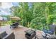 Inviting wooden deck features a dining set and lounge seating, perfect for entertaining at 5342 Lakerock Sw Dr, Atlanta, GA 30331