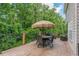 Comfortable wooden deck furnished with a dining table and seating area, ideal for outdoor relaxation at 5342 Lakerock Sw Dr, Atlanta, GA 30331