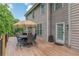 Picture of a lovely deck with a dining table that would be perfect for enjoying the outdoors at 5342 Lakerock Sw Dr, Atlanta, GA 30331
