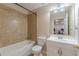 Cozy bathroom featuring tile surround shower-tub and vanity with granite countertop at 5342 Lakerock Sw Dr, Atlanta, GA 30331