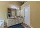 This bathroom provides double sinks, granite countertops and decorative fixtures at 5342 Lakerock Sw Dr, Atlanta, GA 30331