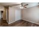 Neutral bedroom with hardwood floors, ceiling fan, and closet for optimal storage at 5342 Lakerock Sw Dr, Atlanta, GA 30331