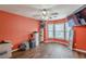 Bright bedroom boasts hardwood floors, natural light, ceiling fan, and storage at 5342 Lakerock Sw Dr, Atlanta, GA 30331
