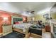 View of the bedroom features a fireplace, sitting area, ceiling fan and hardwood floors at 5342 Lakerock Sw Dr, Atlanta, GA 30331