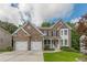 Beautiful two-story brick home with a two-car garage and landscaped front yard at 5342 Lakerock Sw Dr, Atlanta, GA 30331