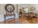 Beautiful foyer featuring hardwood floors, elegant table, and seamless view to the formal living area at 5342 Lakerock Sw Dr, Atlanta, GA 30331