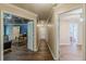 Hallway view showcasing hardwood floors and doorways leading to multiple rooms at 5342 Lakerock Sw Dr, Atlanta, GA 30331