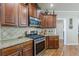 Modern kitchen with stainless steel appliances, granite countertops, and ample cabinet space at 5342 Lakerock Sw Dr, Atlanta, GA 30331