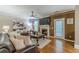 Inviting living room featuring a fireplace, TV, and access to the backyard at 5342 Lakerock Sw Dr, Atlanta, GA 30331