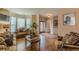 Elegant living room featuring hardwood floors, designer furnishings, and a cozy bay window at 5342 Lakerock Sw Dr, Atlanta, GA 30331