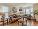 Cozy living room featuring hardwood floors, comfortable sofas, and ample natural light at 5342 Lakerock Sw Dr, Atlanta, GA 30331