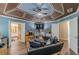 This living room offers hardwood floors, coffered ceilings, and a sitting area at 5342 Lakerock Sw Dr, Atlanta, GA 30331