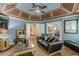 View of the living room, featuring hardwood floors, coffered ceilings, and a sitting area at 5342 Lakerock Sw Dr, Atlanta, GA 30331