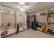 Bright walk-in closet featuring custom shelves and rods for clothing storage at 5342 Lakerock Sw Dr, Atlanta, GA 30331