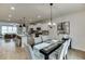 Open floor plan featuring a modern kitchen, adjacent dining area and living room at 1240 Ainsworth Aly # 39, Sugar Hill, GA 30518