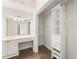 This bathroom features a vanity area and closet space with built-in shelves and drawers at 3475 Oak Valley Rd # 1850, Atlanta, GA 30326