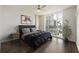 Comfortable bedroom featuring large windows, hardwood floors, and a modern aesthetic at 3475 Oak Valley Rd # 1850, Atlanta, GA 30326