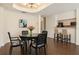 Elegant dining area with a round table, stylish chairs, and a view of the kitchen at 3475 Oak Valley Rd # 1850, Atlanta, GA 30326