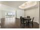 Bright dining room features dark hardwood floors and a modern light fixture at 3475 Oak Valley Rd # 1850, Atlanta, GA 30326