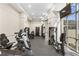 Bright gym featuring exercise equipment, machines, and a large window at 3475 Oak Valley Rd # 1850, Atlanta, GA 30326