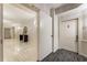 Hallway view of a modern hallway with a white door and a console table at 3475 Oak Valley Rd # 1850, Atlanta, GA 30326