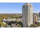 Stunning high-rise building with breathtaking views, set against a backdrop of lush trees and a clear blue sky at 3475 Oak Valley Rd # 1850, Atlanta, GA 30326