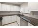 Charming kitchen with white cabinets, granite countertops and stainless steel appliances at 3475 Oak Valley Rd # 1850, Atlanta, GA 30326