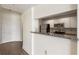 Compact kitchen features stainless steel appliances, granite counters, and white cabinets at 3475 Oak Valley Rd # 1850, Atlanta, GA 30326