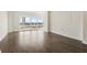 Bright and airy living room featuring hardwood floors and large windows with city views at 3475 Oak Valley Rd # 1850, Atlanta, GA 30326