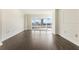 Spacious living room with hardwood floors and a large window overlooking the city at 3475 Oak Valley Rd # 1850, Atlanta, GA 30326