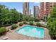 Refreshing outdoor pool surrounded by lush greenery and lounge chairs, perfect for relaxation and recreation at 3475 Oak Valley Rd # 1850, Atlanta, GA 30326